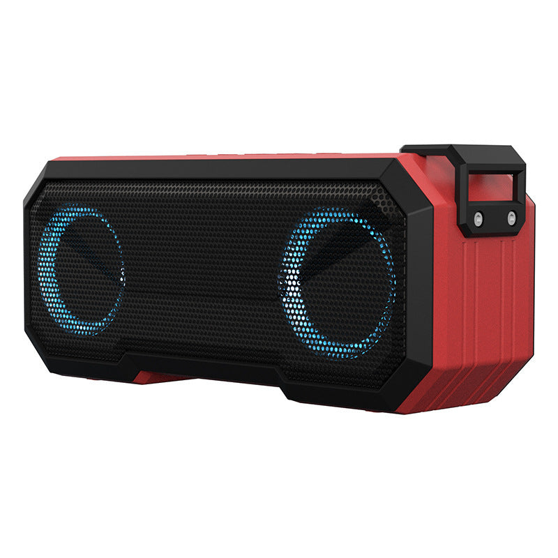 Red and black portable speaker with blue LED lights on a white background