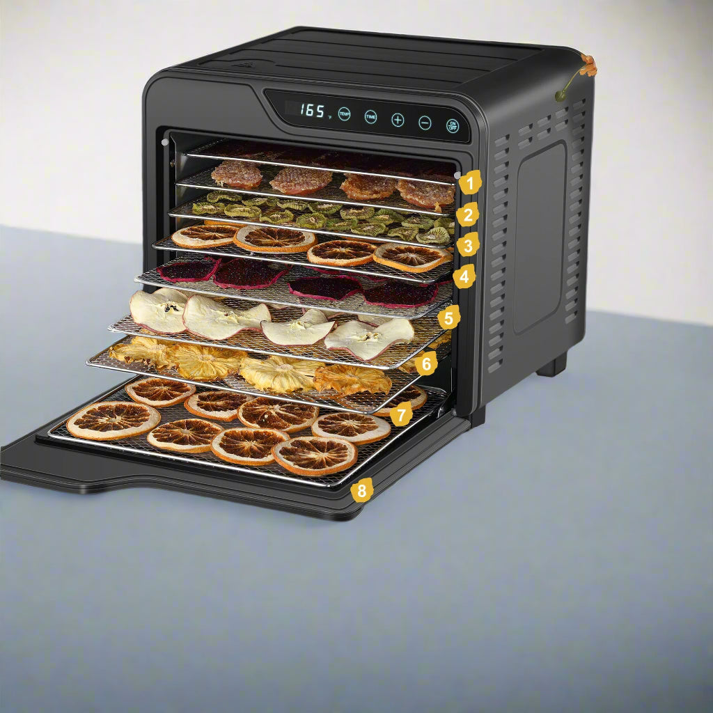Multi-layer food dehydrator with various food items on trays, placed on a table with decorative elements.