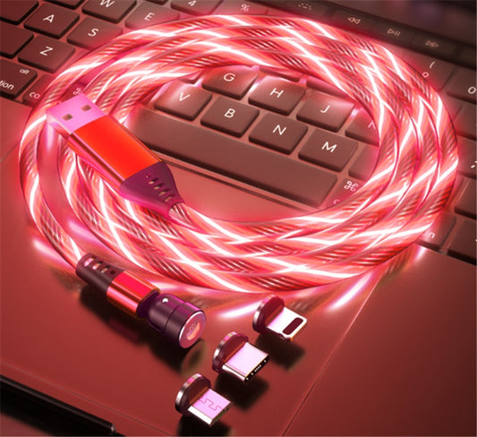 Pink LED cable with connectors on a laptop keyboard