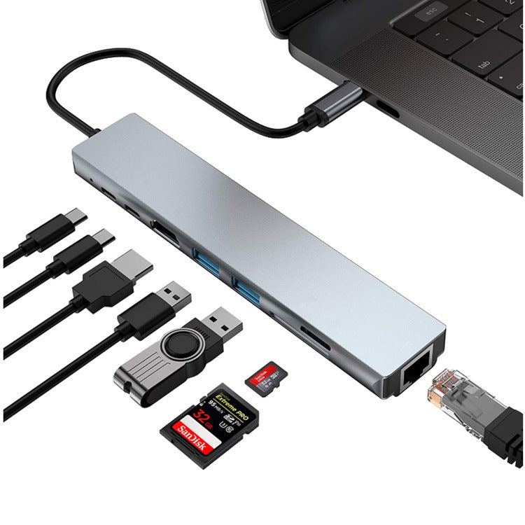 USB hub with multiple cables and accessories on a white background