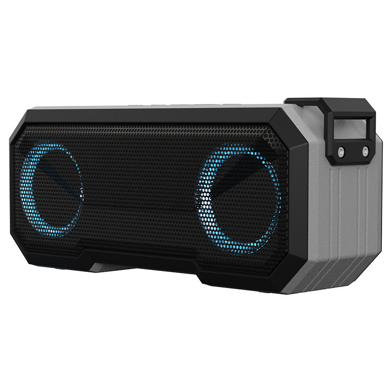 Black and gray portable speaker with blue LED lights on a white background