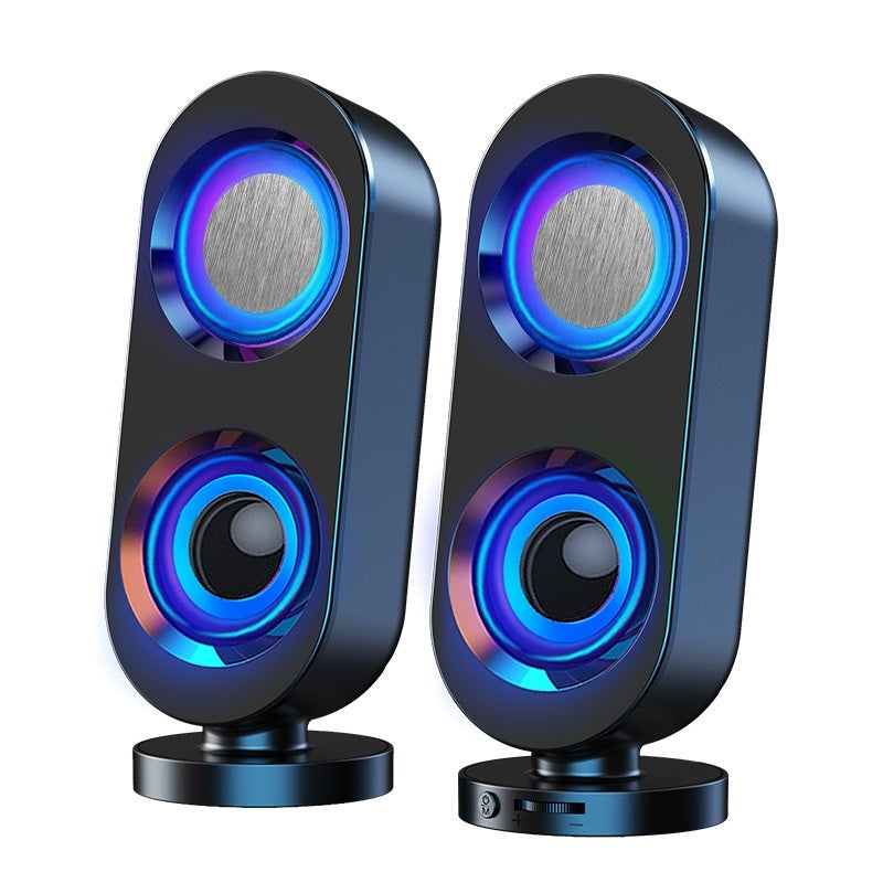 Pair of black speakers with colorful LED lighting on a white background