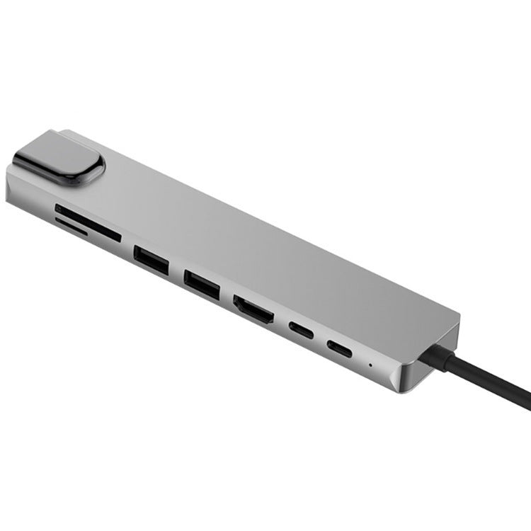 Silver USB hub with multiple ports on a white background