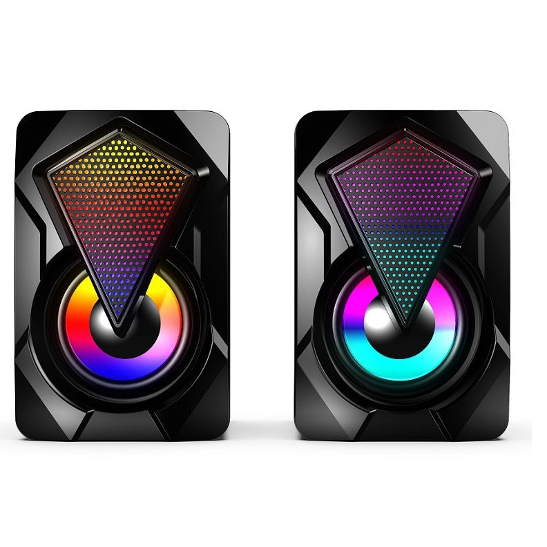 Pair of black speakers with colorful LED lighting on a white background